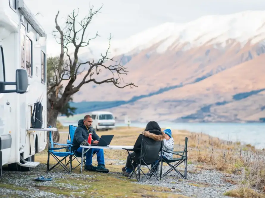 Family hanging out next to Class C motorhome RV