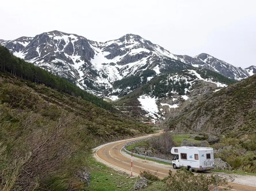 Class C RV motorhome travelling through the mountains