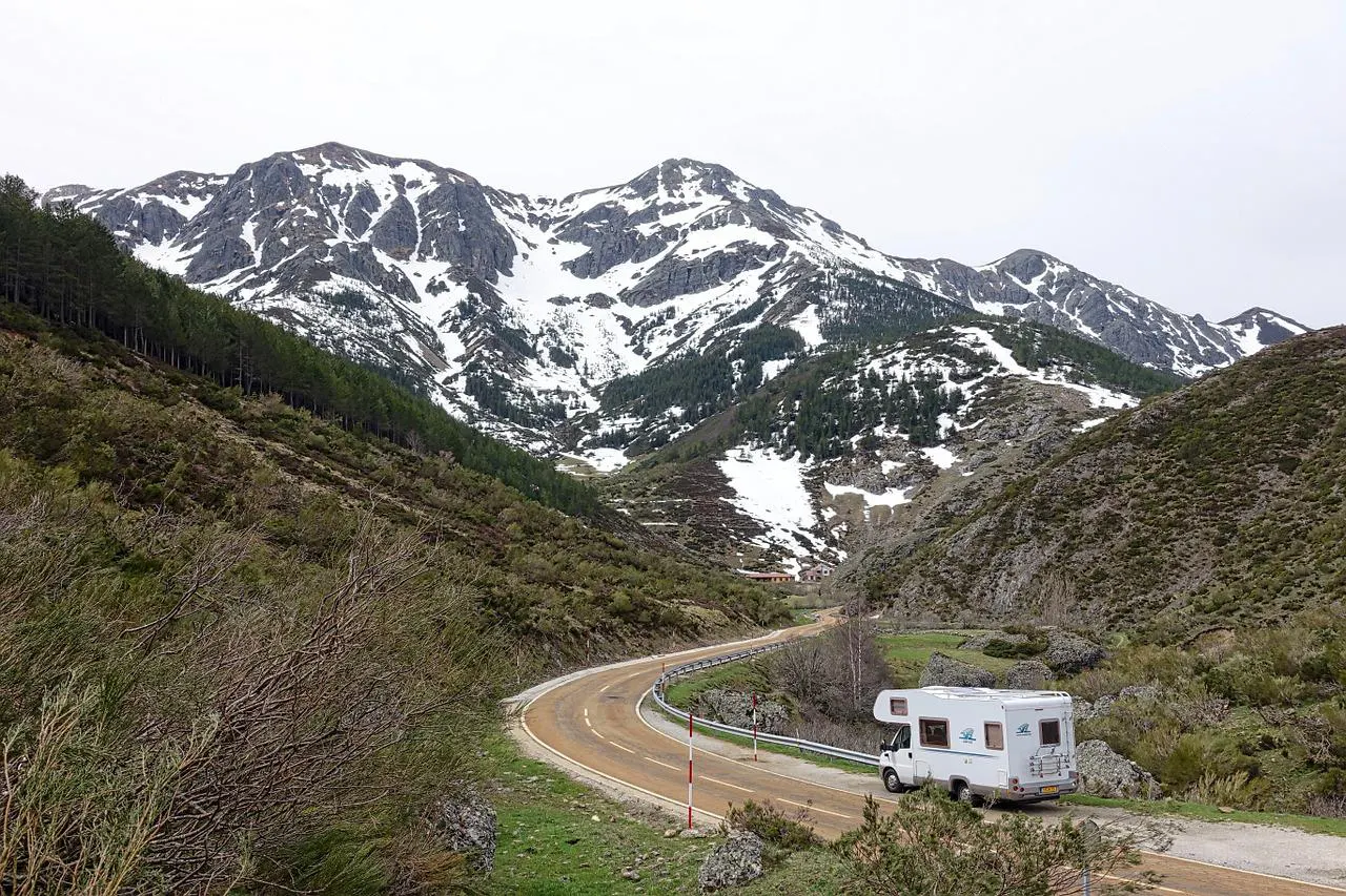 Class C RV motorhome travelling through the mountains
