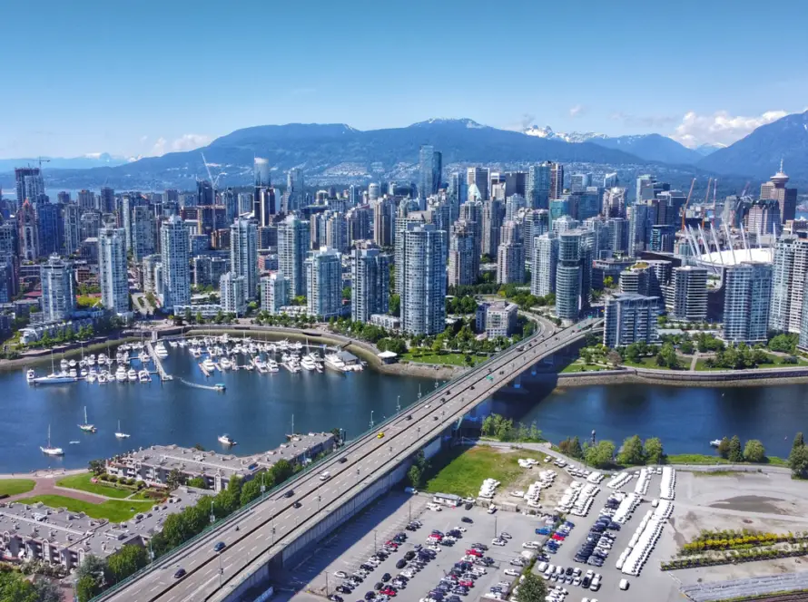 Aerial shot of downtown Vancouver, Yaletown, North Shore mountains, BC Place, False Creek and the Cambie bridge.